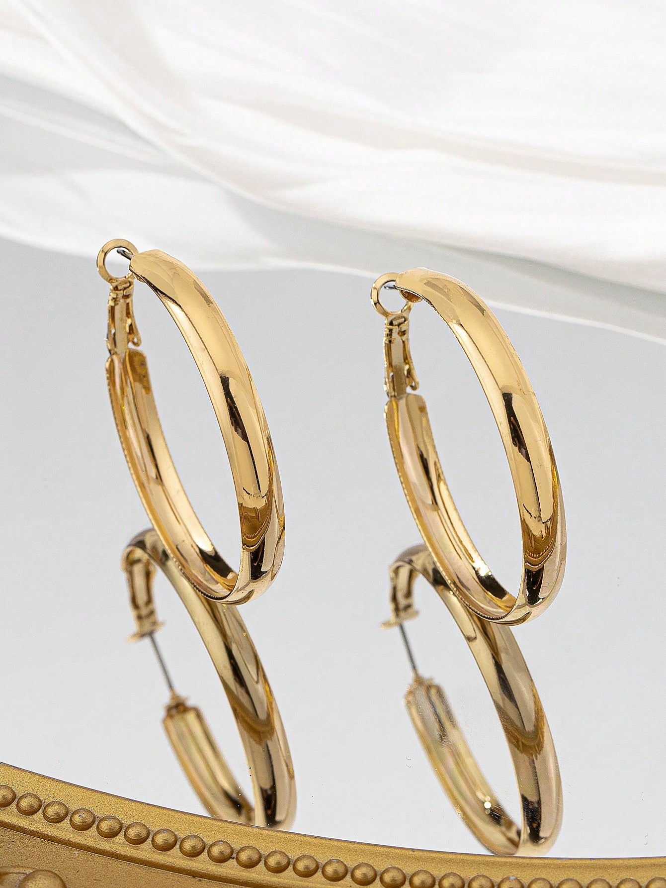 1 paire de boucles d'oreilles