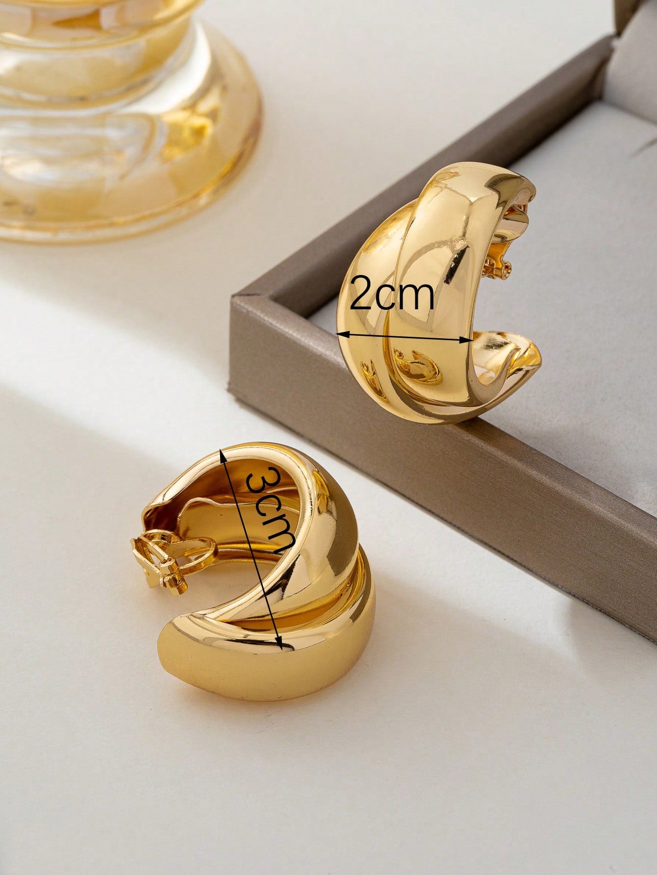 1 paire de boucles d'oreilles